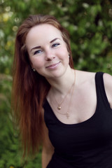 Fototapeta premium portrait of happy red hair girl