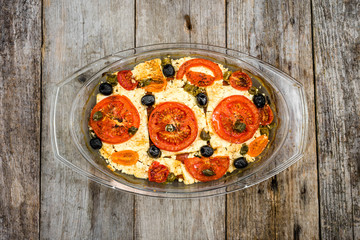 Vegetables baked with feta. healthy eating, vegetarian dish. Greek food of mediterranean cuisine.