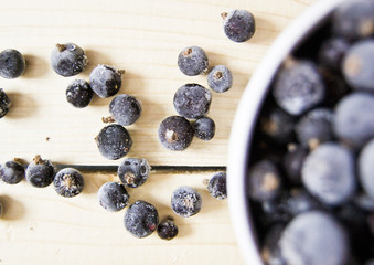 berry, fresh frozen black currants in a cup