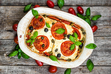Vegetables baked with feta. healthy eating, vegetarian dish. Greek food of mediterranean cuisine.