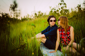 guy and the girl sitting in the grass