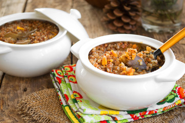 Buckwheat porridge with mushrooms in pots
