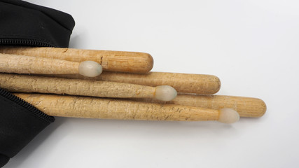 Drum sticks and black bags.