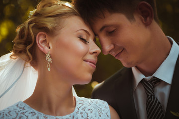 portrait of the bride and groom on the forest background