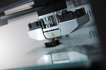 detail of 3d printer printing a plastic piece