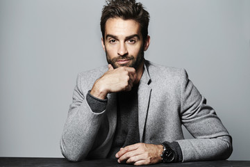 Portrait of man in grey thinking