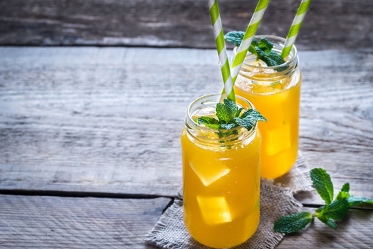 Glass jars of mango juice