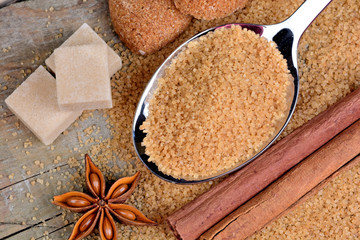 Sugar in a spoon and anise star with cinnamon