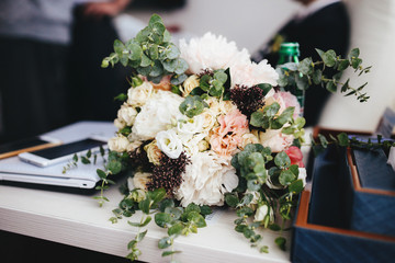 The wedding bouquet stands on the table