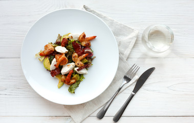 Traditional italian seafood salad with shrimps and mozzarella