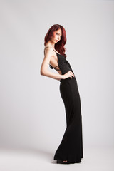 red-haired girl in long black evening dress