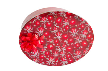 Red oval box for gift with bow on side