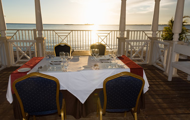 festive table in the gazebo at sunset