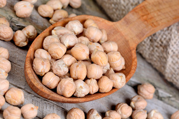 Chick peas in a wooden spoon