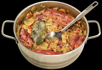 Cabbage with Smoked Pork Ribs Served in Stainless Steel Saucepot Isolated on Black Background