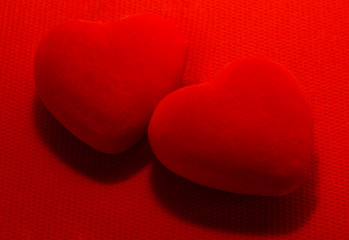 Obraz premium Two red Hearts on red background. For Valentine's day