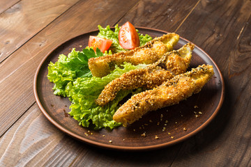 Tasty baked fish on plate table close-up