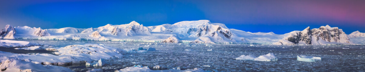 Fototapeta na wymiar panorama of beautiful snow-capped mountains against the blue sky