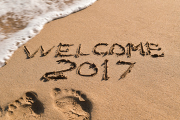 text welcome 2017 in the sand of a beach © nito