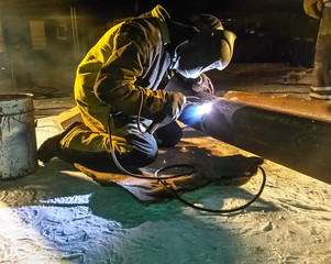 Safety at work. Welding and installation of the pipeline. Industrial weekdays welders and fitters