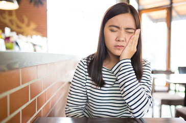 Woman has tooth ache
