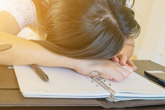 Woman Lying Head Down On The Desk,Work Stress 