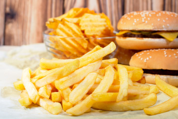 French fries with cheeseburger and chips