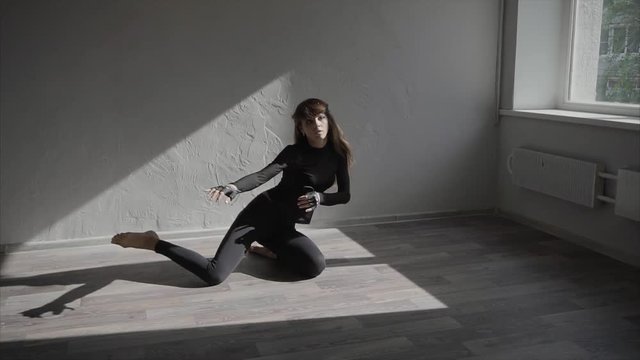 Slow motion shot of a beautiful female dancer practicing in the studio HD