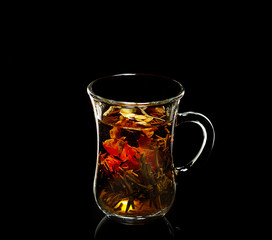 cup with Flower Chinese tea on a black background