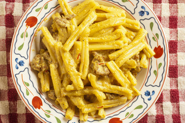 Strozzapreti alla pastora classic Italian pasta and pork dish