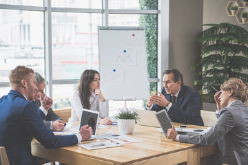 Concentrated employees are listening to their employer