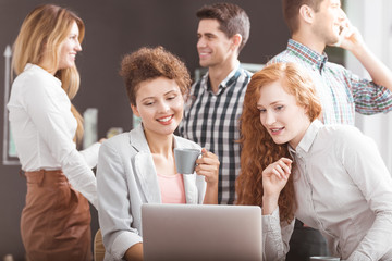 Women working together on laptop