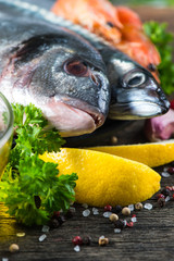 Food background of fresh fish with herbs,cooking concept