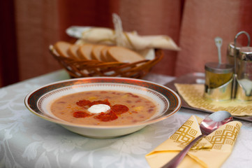 Bean soup with cream sausage on a plate