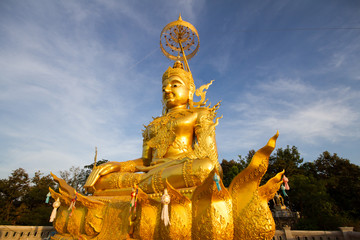 Golden Buddha Image with blue sky