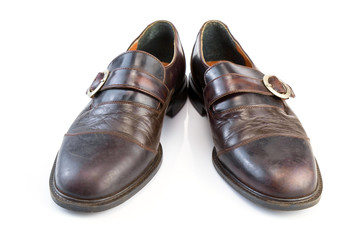 Leather shoes / View of old leather shoes on white background.