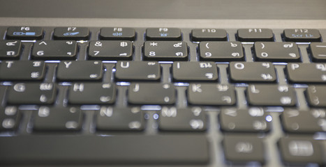 Close up defocus/blur keyboard on laptop. business background concept.