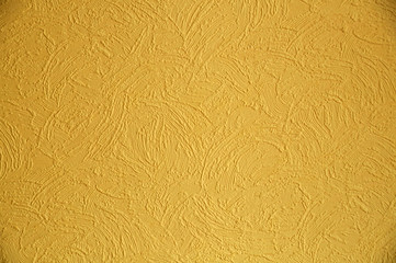 Background texture of yellow paint on the wall