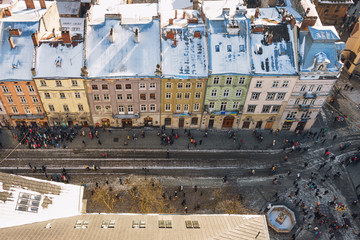 Winter panorama view from the Town Hall on the downtown in Lviv, Ukraine. Old buildings. Roofs covered with snow.