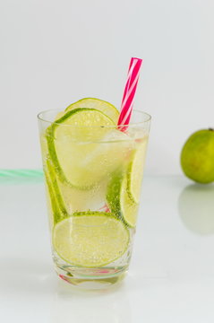 Cold green lime juice with ice cubes