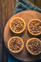 Hand decorated artisan pecan nut tarts