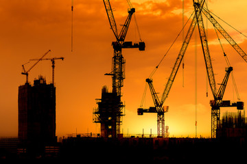 construction cranes and building silhouettes