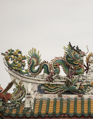 Dragon statue on roof with sky background. Traditional Chinese style art