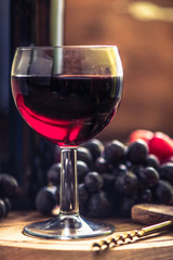 red wine bottle,glass nad fresh grapes