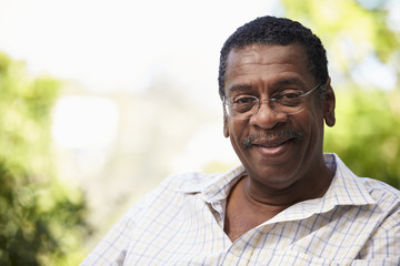 Outdoor Head And Shoulders Portrait Of Senior Man