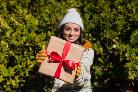 Young female holding a gift