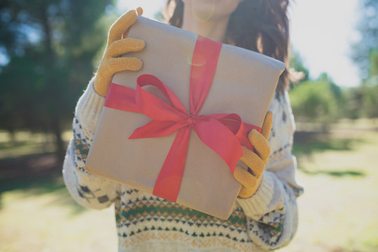 Crop female holding present