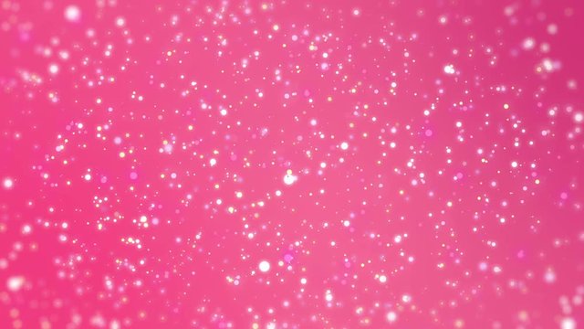 Valentines Day romantic dreamy pink glitter background with sparkling colourful particles and blurred edges.