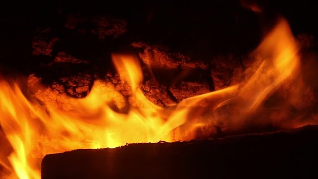 Burning wood logs in fireplace. Burning Fire background 