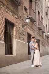 Portrait of smiling young and beautiful couple hugging